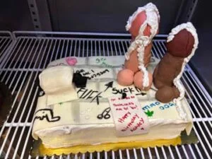 Minneapolis-Minnesota-Stiff-Two-Dick-Hanging-On-Bathroom-Wall-Cake